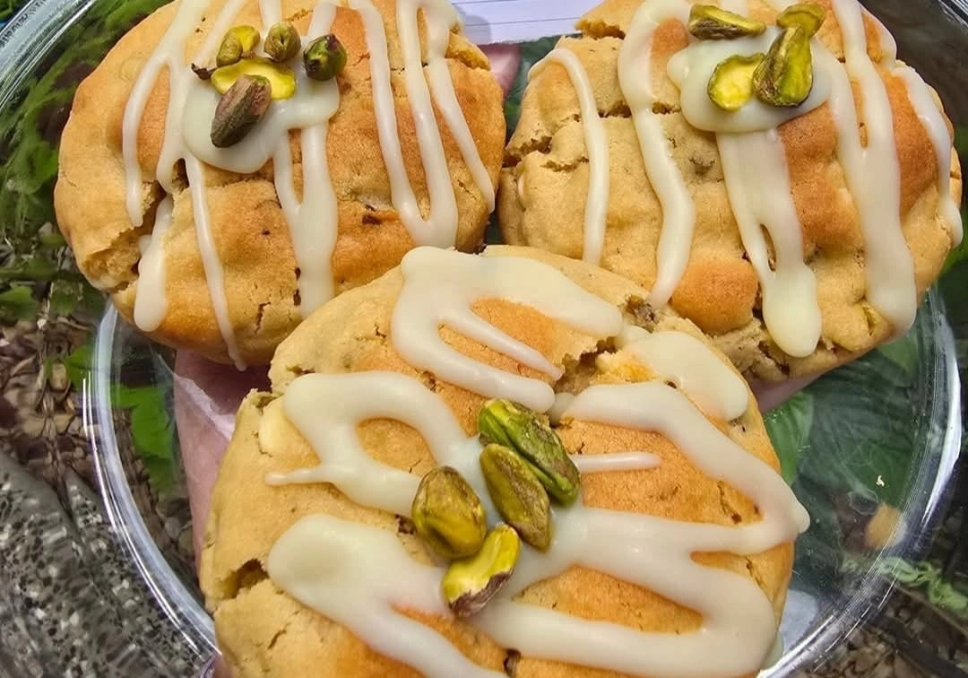 Homemade pistachio cookies with white chocolate drizzle